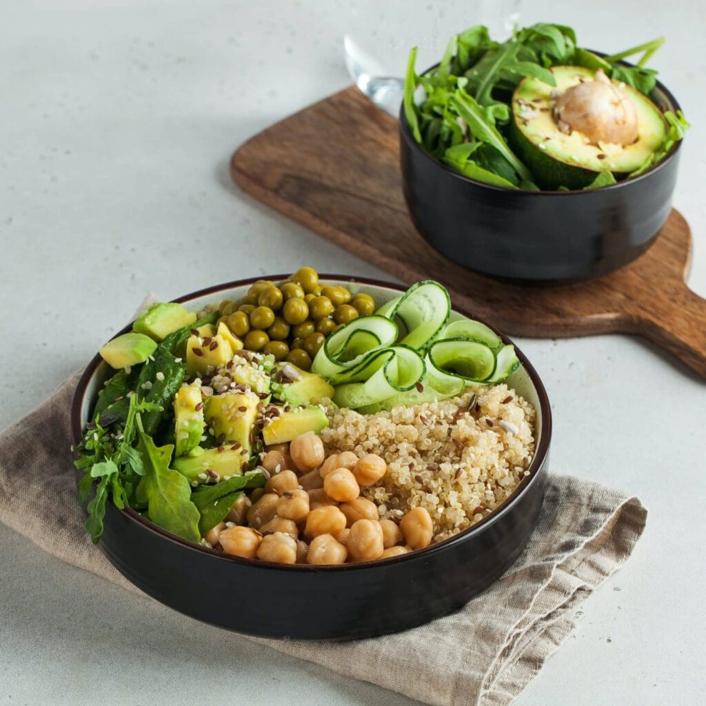 healthy vegetable lunch from the buddha bowl with quinoa avocado chickpeas e1682306640518